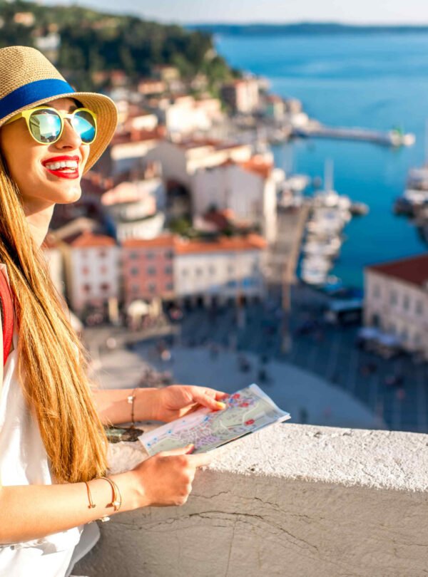 Young female traveler with red backpack and hat enjoying the view from George's tower on Piran old town. Traveling in Slovenia SSUCv3H4sIAAAAAAAEAKVY23KkNhB9T1X+geLZbLgM45m82Y69Tmp37cSOU6mtpUqIZkYxICKJ8U5t+d/T4jIDgmA7eRnDQd3qPn1Ry9++/86y7JhIRu0frW/6Dd9ZllVSCaIYLxB2T1ocEqa4YCTToMae6y+2VERVEmRPhdxWSoGQitNHhIPeakoUbFDNYH1nwufm3eo+1B9RAj/Zt8DLDOyT3hdZxfrLFclZphV2n55PZvScVyxLWLGRP3wgRZIT8SinlF4zqb2lVtytP6pvHr50xJANFHR/dGdMwOee/sFmfnjQ+uWA26yWK7dc8Tlh9+vya+C98yZ1pCicMWLIe+56tXrnee4ymBJKBJBcKpaDKectB1uH6ynxmG1eZ/ltRmgvXn0LoOSSqVqDNFQsgiF3PRuah+dengnIgDRZ2eqwaejSYBV7TuKuqbPwY9dZ+z446emp6/lpAGGYdjvYfryIF+kidFYrCJ1FuF45q8D3nTUkoUd8RIODOUhH6ifucumk8ZI4C3BdJybBqRP6Lgmpl5ym7iFz7VMSxt6KUoeGiess0uXaIWuaOP5yQXxvFaeu79WeNbTYj0+YSXm/XJ54Too+OfYfPIciuoKcZAdeD/lZMmEsv9VIdJfxHRSYI8b6HaFd8R9FHlpQRveC7CAzhdJ674FIa050XaG51nsoEhDHCBZVlhk6eKUSzsUg7vZNC0Z3oBTWobnxnlcI9iX+1Ih1llSZiurf4aYvWCBZAm8ygChsllSx3VDsHEilWFplUf20N8W2dTs6rr8mKroGkjwBEeZaVVOO7PUF7nklsFO09P7G+82x7ZZWEys0OjrTFjI0Y859qAQvwUiWyxqM3gPfCFJuGSWZ9YG32TBD7dxGsku9/kZdPkbnJHskxSiPqTa/L3CBQOu+jk0GWARq1sGGyCGNNRS9nbtZ/6o8N8J1V0OYRERiaZl21bHMJ+Kbd/V2MrJ4MnhvCJ2ZkO2JN8zKGtyPNlP8qTCsfSrGsTCkKhEbyfW7Rqw7CgUc6utkEGDrA0thtH+XQMWbMgg/gjKFHlCCguVYPyuS7aMHvYaP9quKYm/EE5EIfzO22c61mLk8IQVlmqe+4rMGiy54gROX7sOzGd10gZc6g3kkNMPU4Eyooegsy6x21DLzA+eJhOznTwUzS62fAOeJ4l8WTfizYWJYn+8RkIej7fXM1o1/wGt9IDScnG3G7pGy3BsduSxZAVL2m8PFFkDorn6r5xRs+tZlzusojSgW0jhDbwpAbjUcfaryGITFU8uca6e6iZ5vjUPursGiK0JxJLcuv5YCLZ2wIyY4kJHhGGqftyAWyug8kzqfJYC542sCOnsovRSyHdOMGrs+aDC63E10E5LgbUQZDeusBbELkeijvrOAwGEH6r40GnWSozMDLb+gGwWM254+giQlRpu96NBIP41bZWlkgXXPS+smjZBKKlhZZ1GTTmax/7eucryyDGLeopgryAnjItKIsu6UqKiqxHwO/tUwMs3S/507FLLwguYpN7sJa37uejVtORka8ZGU0SeyY5s6P3SR/V2x8uUZgz+NJjVERmxPFDm8ssTnR49ikxE5uPo0x1ULR5d7mBoyN8DFxpC65XnJEl5ZF+i19gEpjTE2G+vXighEOiX6T3vz2uEArW9/39p3UiWM924vOxxAMmn8W6DEwaMp/U6Mq21NY/dOK5xE8h5QcFVb214t7YQozZ/tBZ63cNdB4IbB2g0X9VX3+R/ryoz97BAAAA==